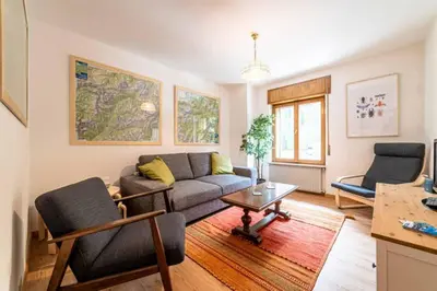 a living room with a couch and a table at Casa Mirabella in Sottoguda