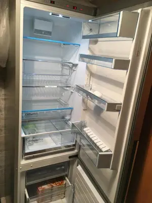 an empty refrigerator with its door open with its door at sonnige schicke Ferienwohnung Meran Pienzenau in Merano