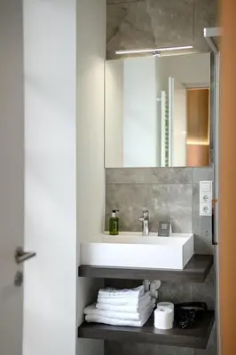 a bathroom with a sink and a mirror at Villa Fauster Pustrabase in Villabassa