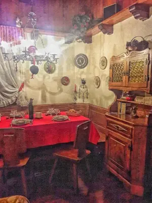 a dining room with a table with a red table cloth at Casa Antelao in San Vito di Cadore