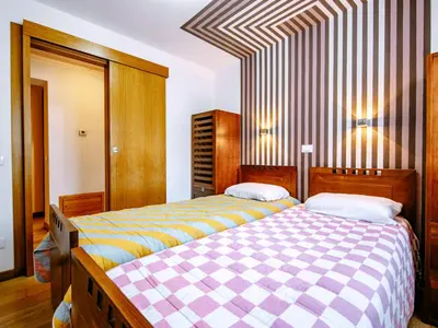 a mirror in a room with a bed at Apartment Cesa Veja by Interhome in Penia