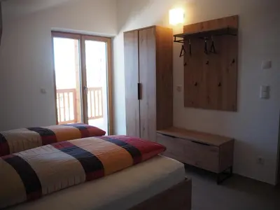 a bedroom with two beds and a window at Ebner Appartements in Aldino