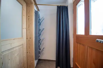 a room with a shower curtain and a window at Apartments Berna in Ortisei