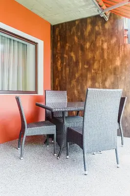 two chairs and a table and a table and chairs at Villa Kranebitt in Bressanone