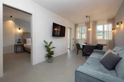 a living room with a couch and a table at Residence - Palais Hörtenberg in Bolzano