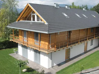 an overhead view of a house with a metal roof at Tauberhof Apartments in Bressanone