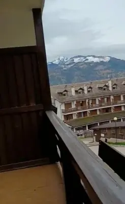 a hotel with a sign in the snow at Appartamento 