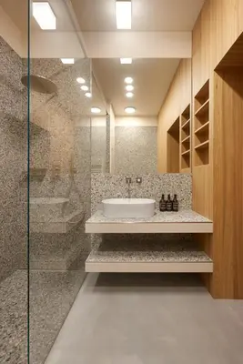 a bathroom with a sink and a glass shower at Goldengel Design-Suiten Frieda Maria im Herzen von Kaltern in Caldaro