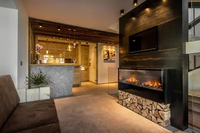a bathroom with a sink and a toilet at Chalet Prades Dolomiti Lodges in La Villa