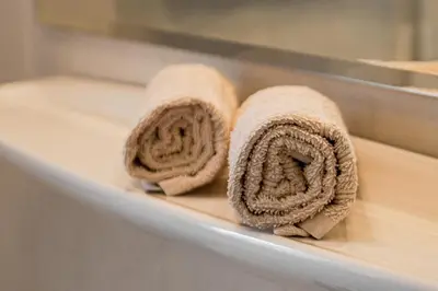 two rolled up towels sitting on a shelf at Ciüf de Munt in Badia