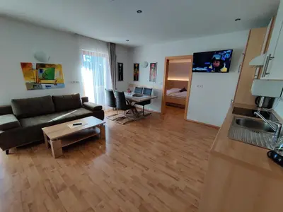 a living room with a couch and a table at Residence Klementhof 3 in Fiumes