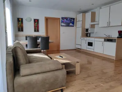a living room with a couch and a table at Residence Klementhof 3 in Fiumes
