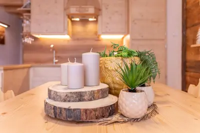 a table with candles on top of a table at Chalet Laura in Alleghe