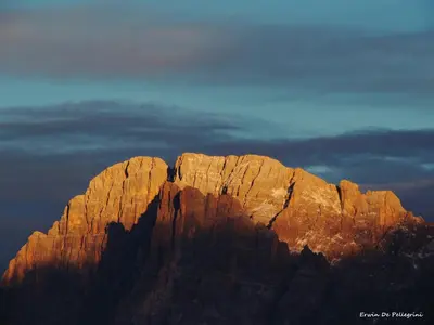 a view of a mountain in the sunset at Chalet Laura in Alleghe