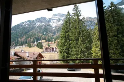 a view of a mountain from a window at Residence Roacia in Alba di Canazei