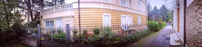a building with a fence in front of it at Villetta Italia IT.CU in Merano