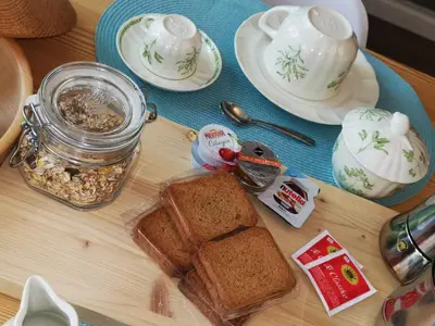 a table with a jar of peanut butter and bread at Villetta Italia IT.CU in Merano
