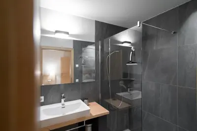 a bathroom with a sink and a mirror at Oberzerod Apartments in Siusi