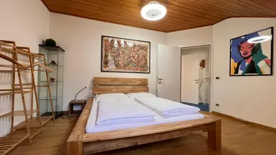 a bedroom with a bed and a ladder in it at NEW Suite mar e monti in Appiano sulla Strada del Vino