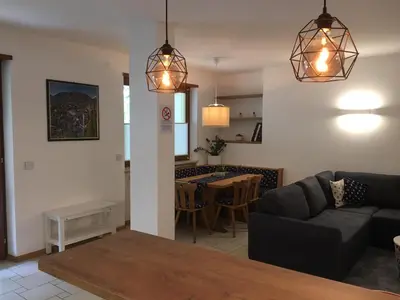 a living room with a couch and a table at LaSiesta Merano in Merano