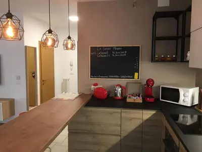a kitchen with a counter top with a microwave at LaSiesta Merano in Merano