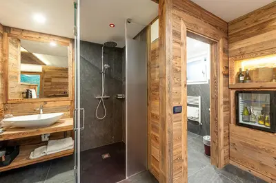 a bathroom with a shower and a sink at Hotel Majon Miramonti in Canazei