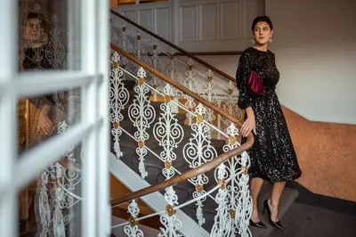 a bedroom with a bed and a mirror at Hotel Europa Splendid in Merano