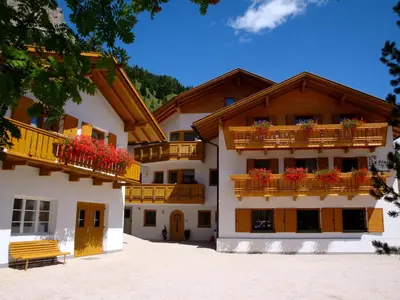 a building with flower boxes on the balconies at La Pineta in Colfosco