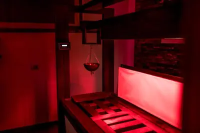 two woman in bathing suits standing in a shower at Hotel La Maison Wellness & Spa in Alleghe