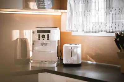 a coffee maker on a counter in a kitchen at dolomites view apartment in Rasun di Sopra
