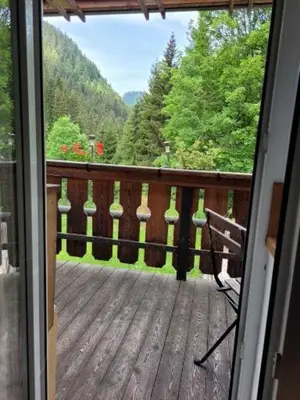a view from a door of a deck with a view at Gassermühle - Studio Appartments in Eggen
