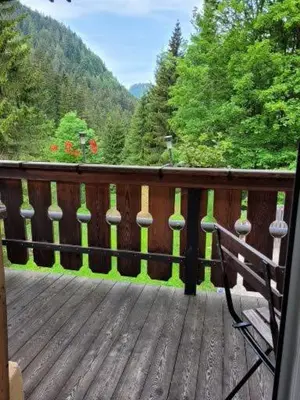 a bench sitting on a wooden deck with a view at Gassermühle - Studio Appartments in Eggen