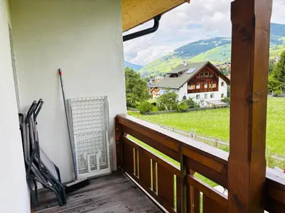 a balcony with a view of a house at Ciasa Fam Comploi in San Vigilio Di Marebbe