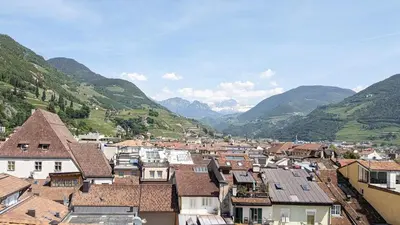 a view of a town with mountains in the background at Erker Apartment in Bolzano