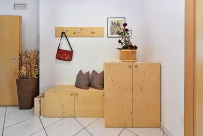 a shelf with two pillows on it next to a wall at Fuchshof in Perca