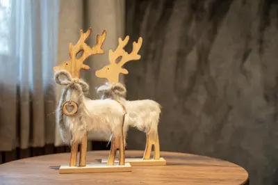 two miniature animals with antlers on a table at Villa A - NEW OPENING in Selva di Val Gardena