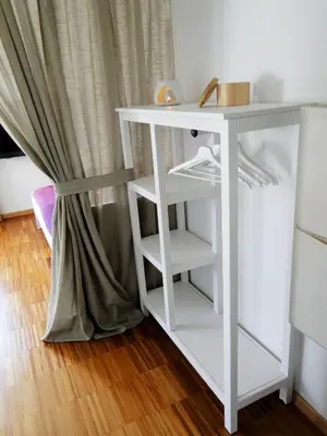 a small white table next to a curtain at Gemütliches Studio mit Parkgarage in Naturno
