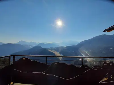 a view of a mountain with the sun in the sky at Canalhof in Antermoia