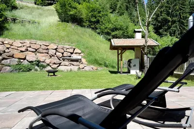 a pair of lawn chairs sitting on a patio at Unterurban DIE EINS in Unsere Liebe Frau im Walde