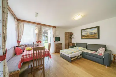 a living room with a couch and a table at Apartment Romana in Selva di Val Gardena