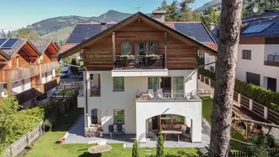 an aerial view of a house with solar panels on the roof at Les Gomines BB***** in San Vigilio Di Marebbe
