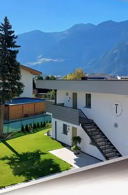 a rendering of a house with a staircase at T-Collection Premium Apartments in Vipiteno