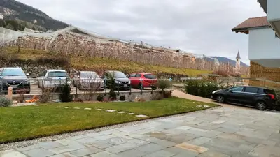 a group of cars parked in a parking lot at Agritur La Fenice in Brez