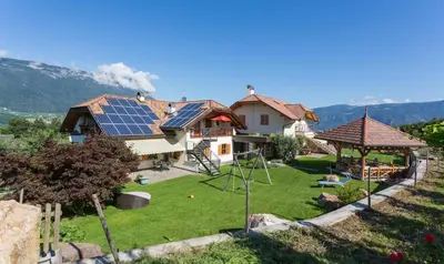 a house with solar panels on the roof at Lavendelhof in Appiano sulla Strada del Vino
