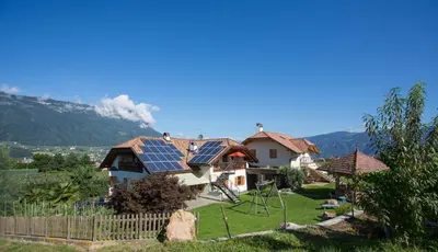 a house with solar panels on top of it at Lavendelhof in Appiano sulla Strada del Vino
