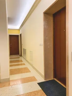 an empty room with a door and a hallway at Palais Carducci in Bolzano