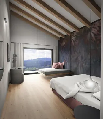 a bedroom with a large bed and a large window at Alpuris - Your Boutique Suite - Hotel B&B in Cavalese