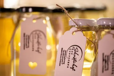 a group of mason jars with labels on them at Appartement Schusterhof in Gries