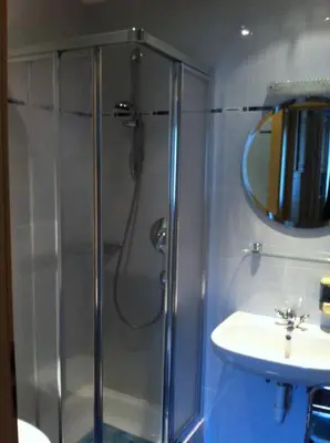 a bathroom with a shower and a sink at villa mahlfertheiner in Castelrotto