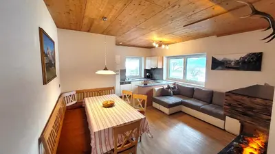 a living room with a couch and a table at Appartements Tirol in San Lorenzo di Sebato